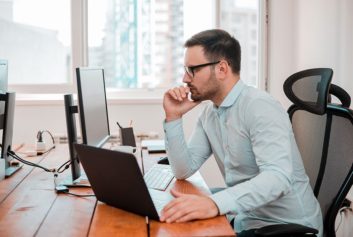 business man in office using computer