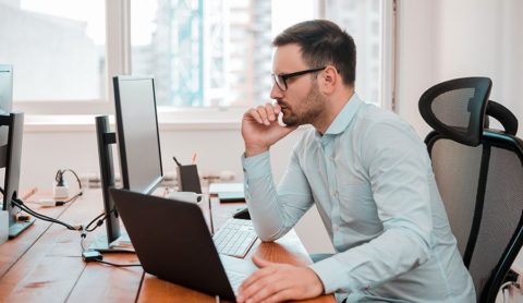 business man in office using computer