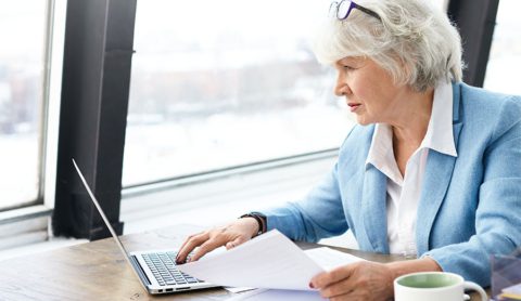 experienced manager working on laptop